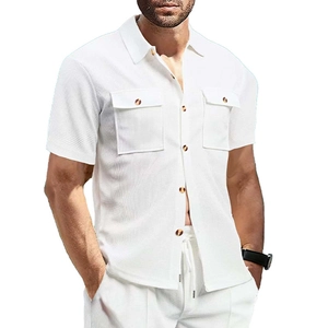 Detailed macro shot of white waffle textured fabric on men's short sleeve shirt with pockets