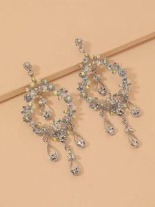 Detail of silver wreath earrings with colorful rhinestones and waterdrop pendants