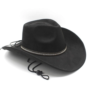 Detail of black faux suede cowboy hat featuring rhinestone band and adjustable chin strap