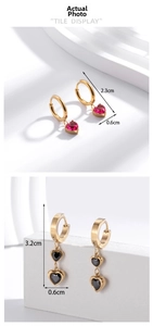 Detail view of heart-shaped gemstone earrings with precise size measurement markings