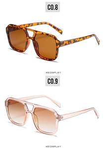 Detail view of square double-bridge sunglasses in leopard tortoise and transparent pink frames