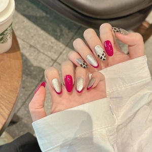 Handmade oval press-on nails featuring rose pink leopard print and silver glitter cat-eye finish