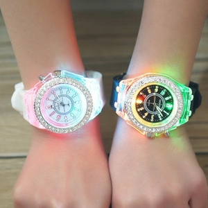 Detail of LED luminous watches with silicone bands and rhinestone bezels in white and black