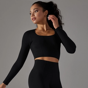 Close-up of black seamless honeycomb knit texture on long sleeve yoga set