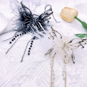 Elegant butterfly feather hair claw clips with tassels in black and white finish