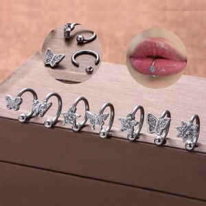 Detailed set of 7 silver stainless steel lip rings with CZ butterfly and flower charms