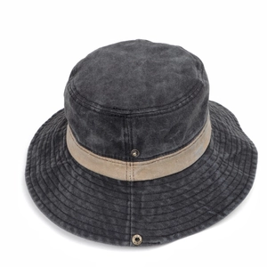 Close-up of vintage washed cotton fabric texture and khaki trim on the boonie hat