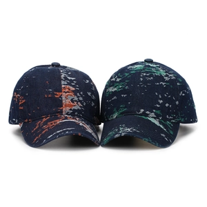 Detail of vintage jacquard baseball caps with abstract patterns in blue, orange, and green