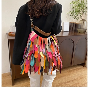 Detail of colorful tiered fringe tassels on the large capacity leather shoulder bag