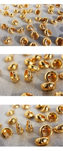 Macro detail of gold teardrop hoop earrings with micro-set starburst zircon accents