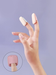 Detailed view of mini finger powder puffs for precise makeup application on eyes and nose