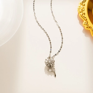 Detailed view of silver sunflower necklace pendant with sparkling zircon gemstones