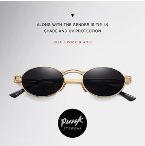 Close-up of steampunk oval sunglasses with gold metal frame and spring hinge details