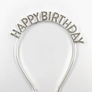 Detail of silver birthday headband featuring sparkling rhinestones with Happy Birthday text