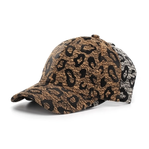 Close-up detail of leopard print lace texture and firm crown on stylish baseball caps
