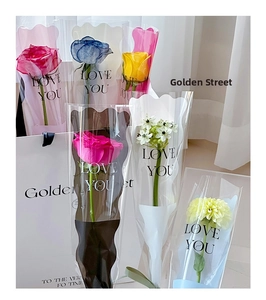 Detail of single flower bouquet packaging with translucent wavy edges and LOVE YOU print