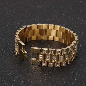 Detail of gold watch band bracelet with three rows of sparkling crystal rhinestones