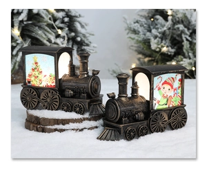Detail view of retro bronze Christmas train lanterns with glowing warm lights and illustrations