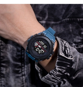 Close-up of men's waterproof sports watch with digital display and dark blue strap