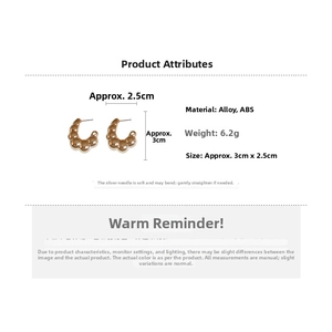 Detail view of gold C-shaped bubble earrings showing 3cm dimensions and alloy material