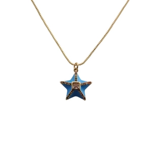 Elegant gold necklace with a blue star pendant featuring colorful crystals and a center gem