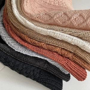 Detailed close-up showing various colors and cable knit textures of summer bucket hats