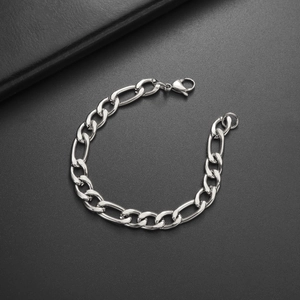 High-quality silver stainless steel Figaro chain bracelet with lobster clasp on black background