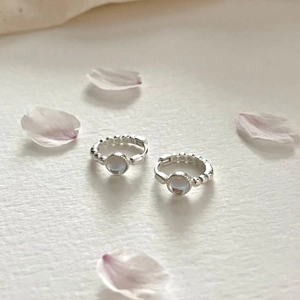 Elegant 925 sterling silver hoop earrings featuring round light blue moonstone charms