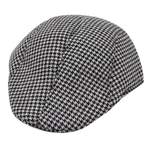Classic black and white houndstooth flat cap in vintage British style for men