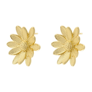 Macro detail of gold flower stud earrings with textured petals on white background