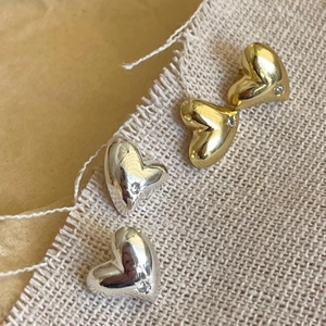 Polished 925 sterling silver and gold heart stud earrings set with zircon stones