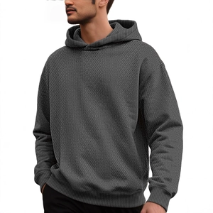Men's dark grey loose hoodie featuring jacquard waffle knit texture and drop shoulders