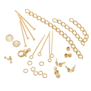 Detailed assortment of golden lobster clasps and open jump rings for DIY jewelry making
