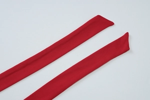 Detail view of the red fabric halter ties showing high-quality woven texture and finish