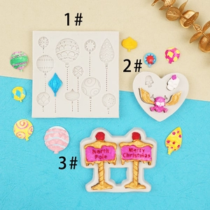 Detail view of silicone molds featuring Christmas signs and heart skulls for DIY crafts