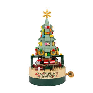 Rotating Christmas tree building block music box with festive ornaments and wind-up key