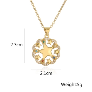 Macro view of gold plated star pendant featuring colorful gemstones and floral hollow design