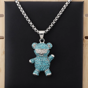 Detailed view of hip hop panda pendant with blue rhinestones and silver glasses