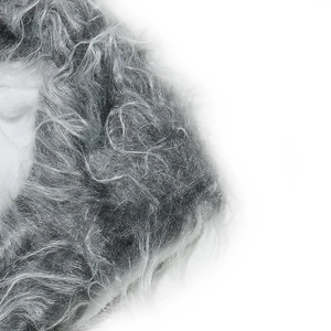 Macro detail of the grey faux fur fabric showing soft and fluffy plush texture on the hat