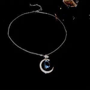 Crescent moon and blue teardrop pendant necklace with sparkling zircon pavé on chain