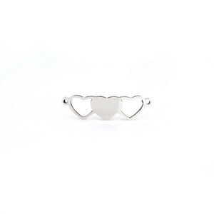 Close-up of alloy heart-shaped magnetic connectors for DIY jewelry making accessories