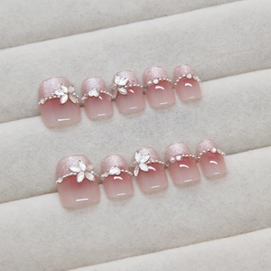 Handmade pink gradient press-on nails with silver glitter and white marquise rhinestone flowers