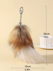 Detail view of fox tail keychain with dimensions 30cm and silver metal hook clip