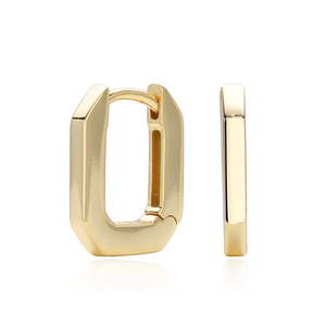 Macro shot of minimalist gold geometric U-shaped hoop earrings with a polished mirror finish
