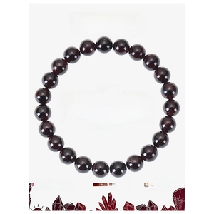 Detail showing 8mm garnet beads on elastic cord with informative crystal energy card