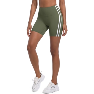 Close-up of olive green high-waisted yoga shorts with side stripes and elastic fabric