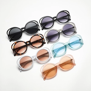 Fashionable oval hollow-out sunglasses in seven colors including black and tortoiseshell
