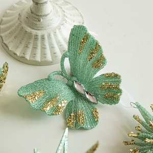 Mint green butterfly Christmas ornament with gold sequins and sparkling glitter finish