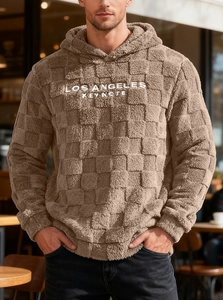 Close-up of Los Angeles embroidery on brown fleece textured oversized hoodie