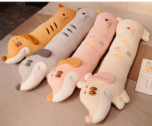 Detail view of colorful soft plush dachshund body pillows with happy star embroidery